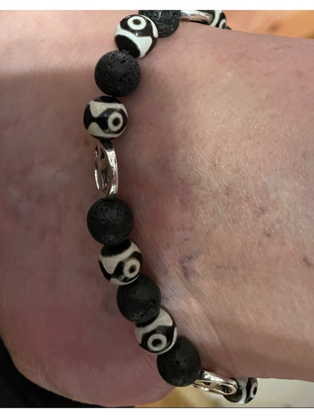 9-Bead Tibetan polish bead Anklet with lava beads and peace signs.